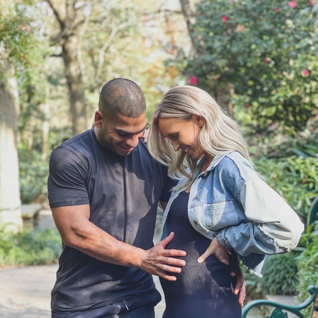 Sage with his partner Milly as they await the birth of their child
